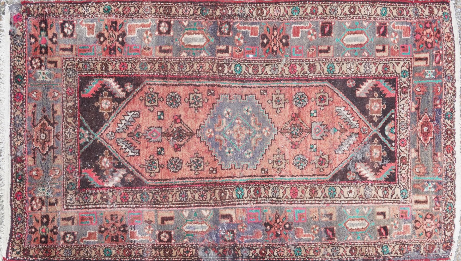 Rectangular Persian red ground rug having an all over geometric design, 210cm x 130cm : For