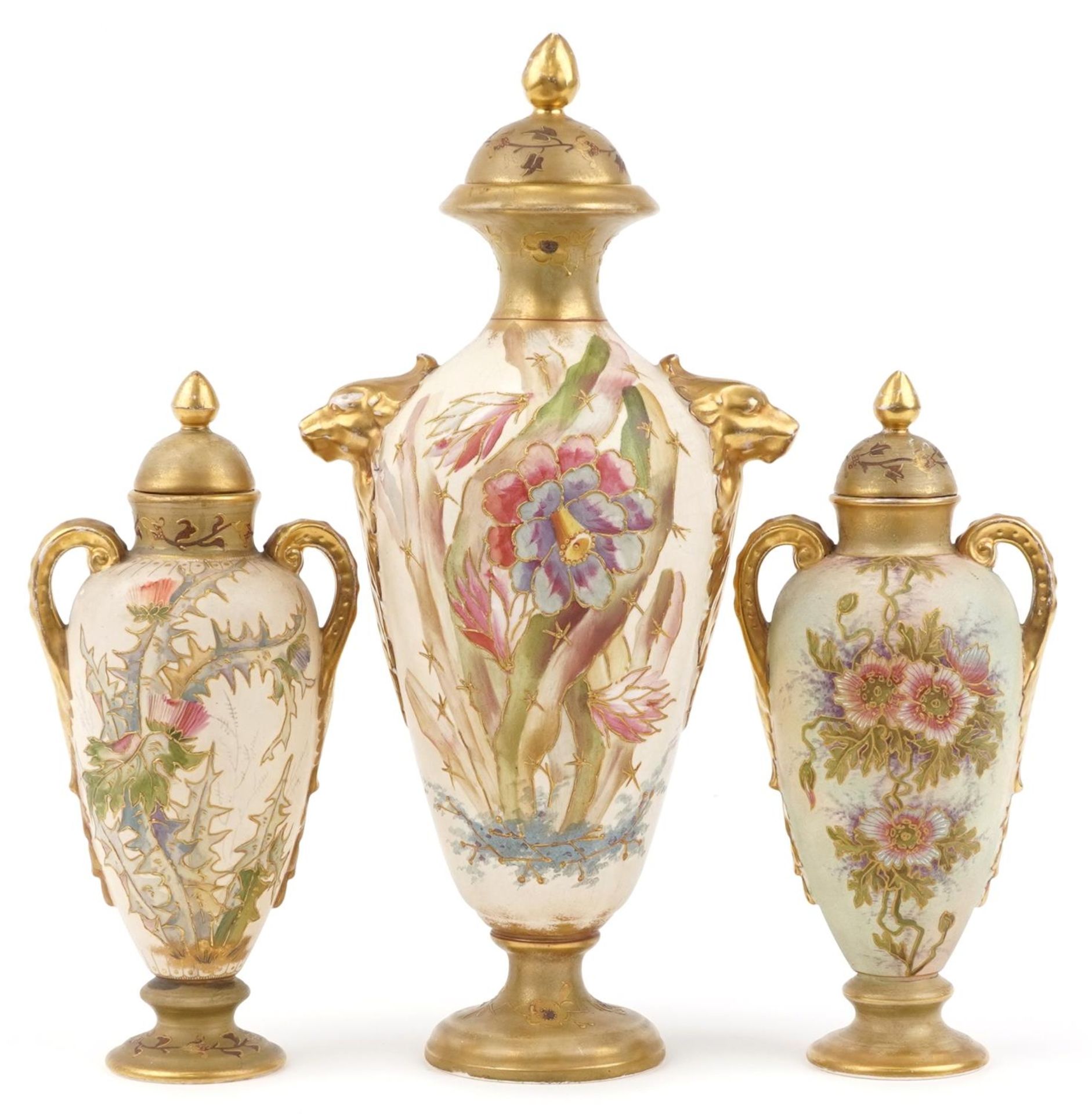 Royal Bonn, garniture of three blush ivory vases and covers with handles, each decorated with