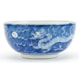 Chinese blue and white porcelain bowl hand painted with dragons chasing the flaming pearl amongst