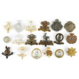 Military interest cap badges including Military Foot Police, Royal Monmouthshire and a Loyal Service