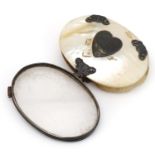 19th century unmarked silver and mother of pearl folding magnifying glass with love heart cartouche,