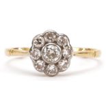 18ct gold diamond flower head ring, the central diamond approximately 0.20 carat, size R, 2.3g : For