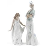 Two Lladro porcelain figurines including a walk with the dog, numbers 4893 and 6975, the largest