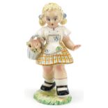 Manner of Lenci, 1970s Italian porcelain figure of a young girl holding a basket of flowers, 21cm