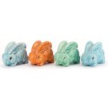 Four early 20th century art pottery rabbits, possibly Sylvac, 13cm in length : For further