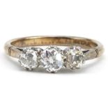 18ct gold and platinum diamond three stone ring, total diamond weight approximately 0.60 carat, size