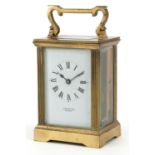 Brass cased carriage clock with enamelled dial having Roman numerals, inscribed E W Payne Bromley,