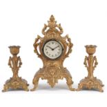 French Rococo style gilt metal mantle clock with garniture candlesticks, the largest 21.5cm high :