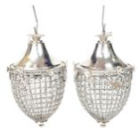 Pair of ornate silvered acorn design chandeliers decorated with swags and bows, 52cm high : For