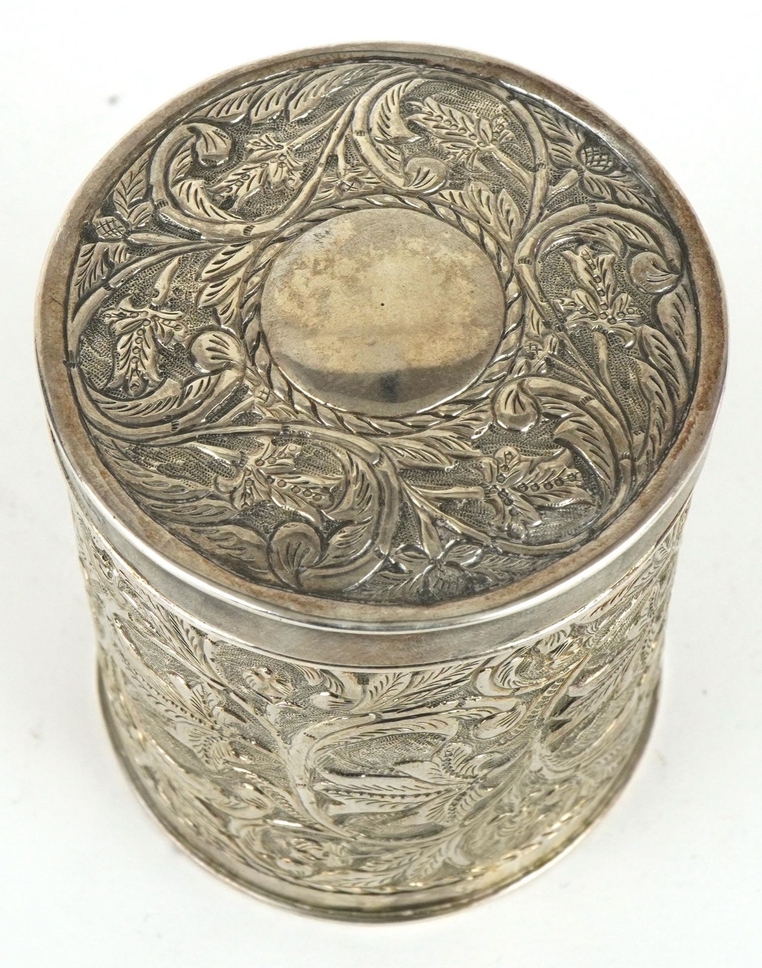 Anglo Indian cylindrical box and cover profusely embossed with flowers and foliage, engraved from - Image 2 of 4