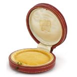 Cartier, vintage French tooled leather jeweller's box, 6.5cm in diameter : For further information