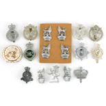 Military interest cap badges and a United Nations enamelled pin badge including War Department