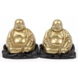 Pair of Chinese brass Buddhas raised on carved hardwood stands, each 10cm wide : For further