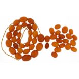 Butterscotch amber coloured graduated bead necklace, the largest bead approximately 20mm x 14mm,