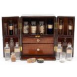 Early 19th century mahogany chemist's apothecary chest with inset brass carrying handle housing