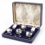 Mappin & Webb, Art Deco octagonal silver six piece cruet with blue glass liners housed in a Mappin &