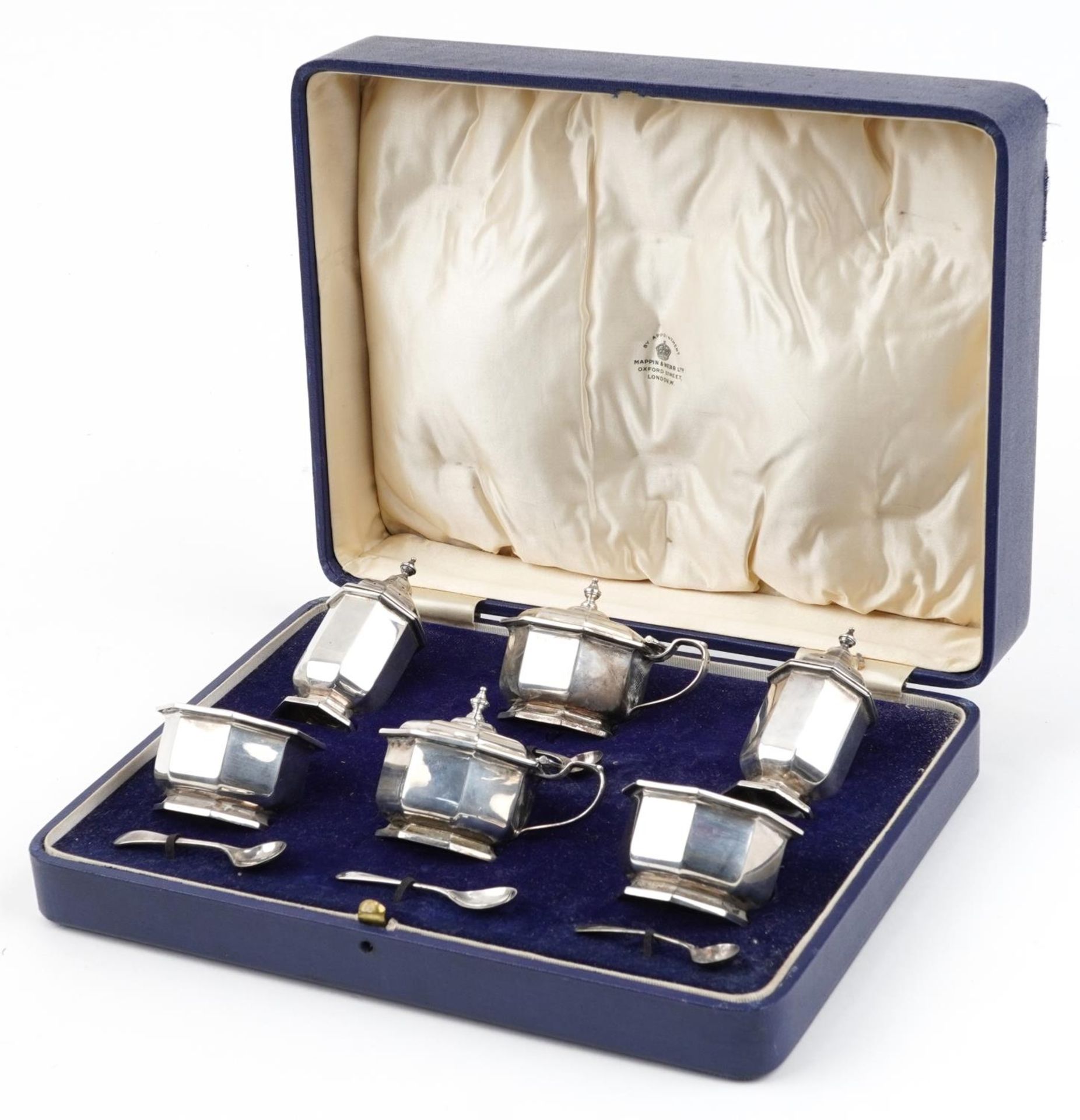 Mappin & Webb, Art Deco octagonal silver six piece cruet with blue glass liners housed in a Mappin &