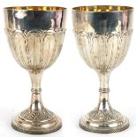 Thomas Daniell, pair of George III silver goblets embossed with stylised leaves and gilt