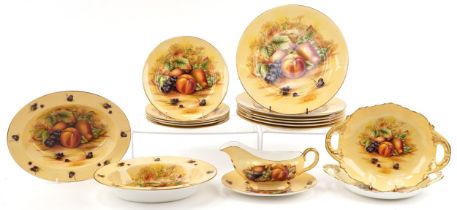 Aynsley Orchard Gold dinnerware including dinner plates, oval fruit bowls and sauceboat on stand,
