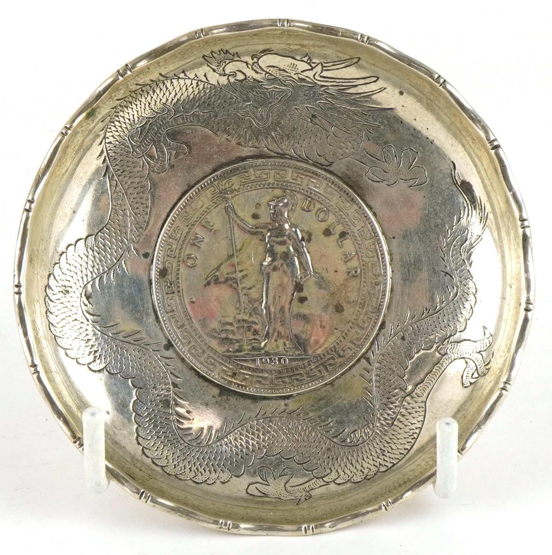 Chinese export silver dish engraved with a dragon inset with a 1930 trade dollar, W N maker's