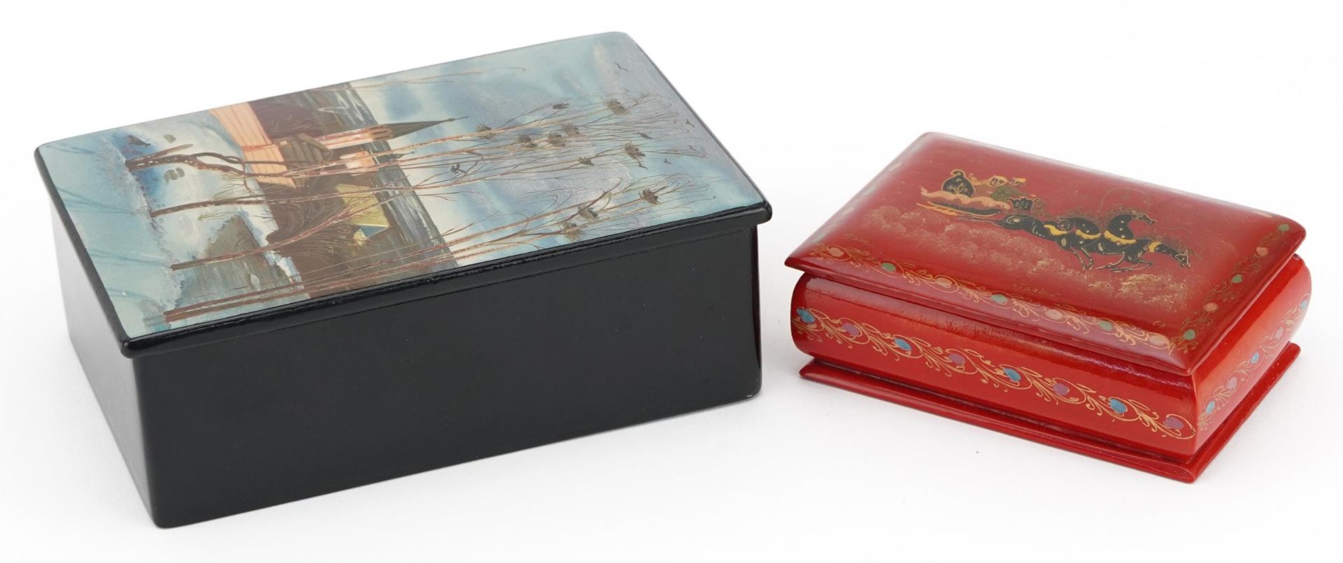 Two Russian lacquered boxes including one hand painted with a snowy village, 4.5cm H x 13.5cm W x