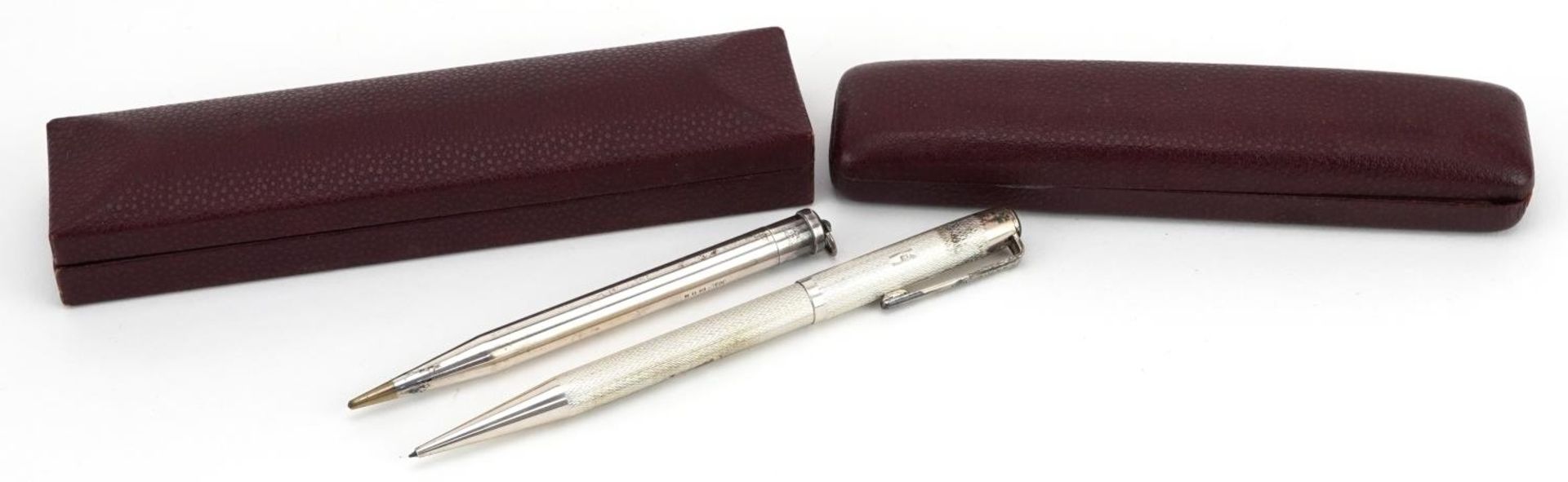 Two silver propelling pencils with cases comprising Yard-O-Led and Yard-O-Lett : For further