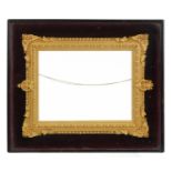 19th century Gesso frame housed in an ebonised display case with red velvet mount, overall 34cm x