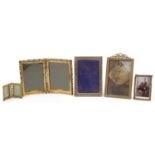 Five vintage brass floral photo frames including clover folding examples, the largest 9cm high : For