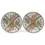 Pair of Chinese Canton porcelain shallow dishes hand painted in the famille rose palette with