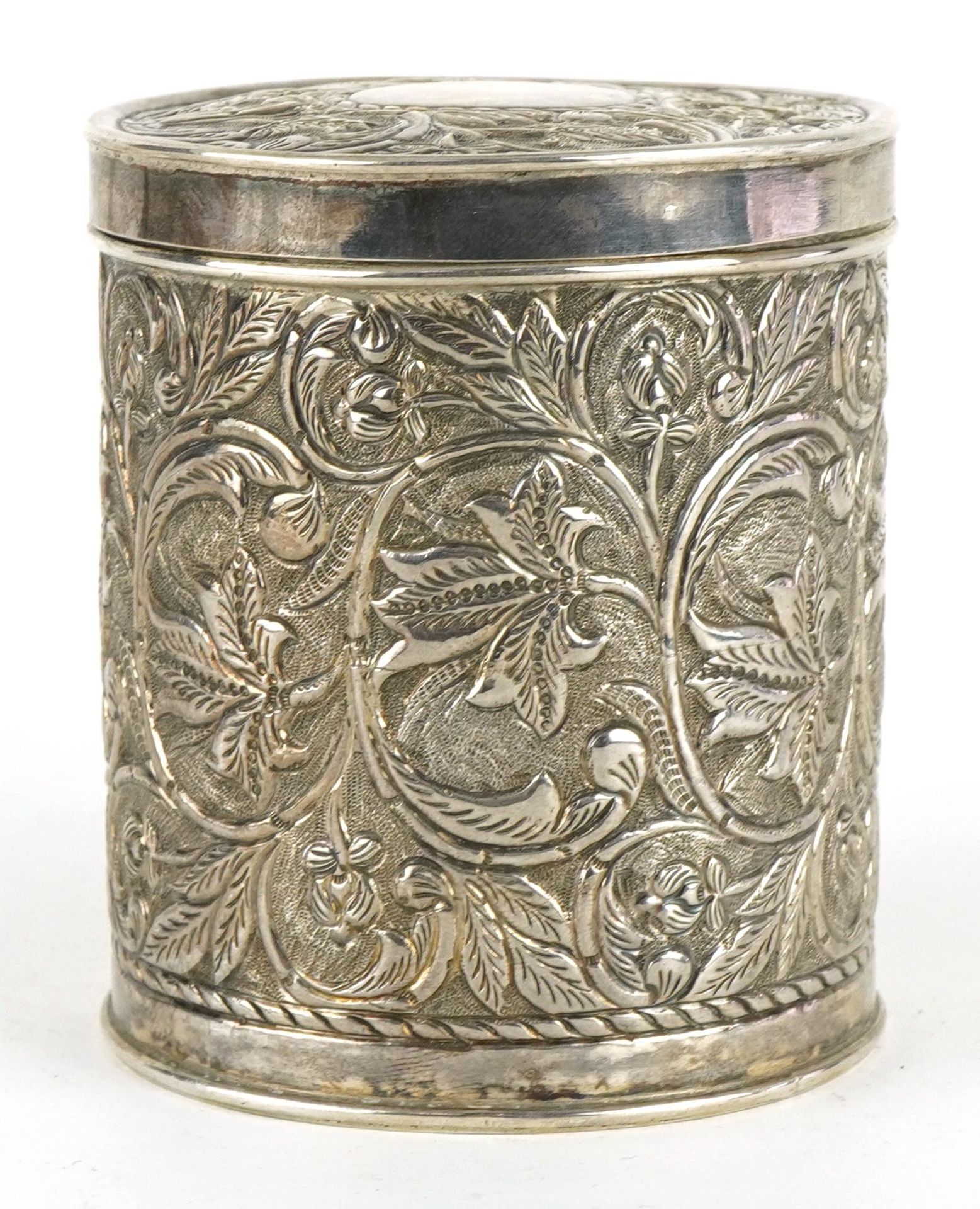 Anglo Indian cylindrical box and cover profusely embossed with flowers and foliage, engraved from - Image 3 of 4