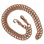 9ct rose gold watch chain with dog clip clasps, 42cm in length, 28.0g : For further information on