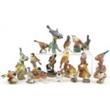 Nineteen Royal Worcester and Goebel porcelain bird groups including Chaffinches, Pied Woodpeckers