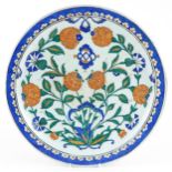 Turkish Ottoman Iznik pottery plate hand painted with stylised flowers, 30cm in diameter : For