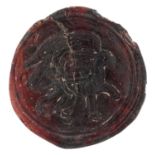 11th century Persian glass seal medallion decorated in relief with bird and mythical animal, 5.5cm