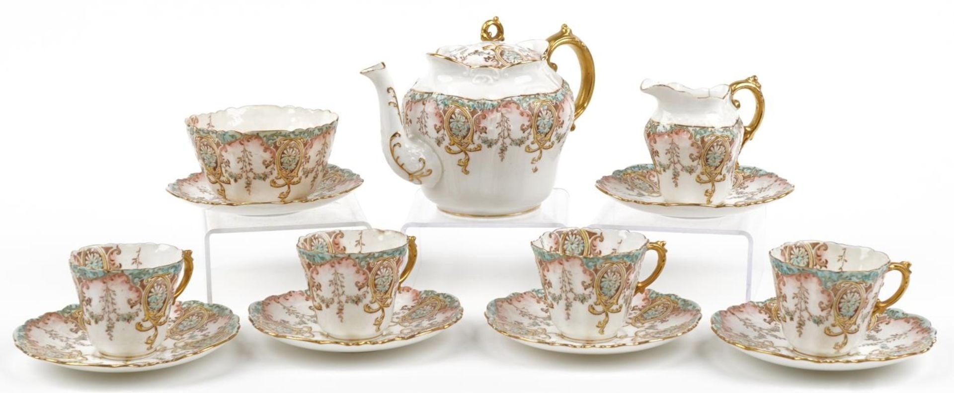 Victorian Aynsley teaware decorated with flowers comprising teapot, four cups, six saucers, milk jug