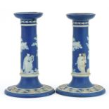 Pair of Wedgwood Jasperware candlesticks decorated in relief with classical figures, each 17cm