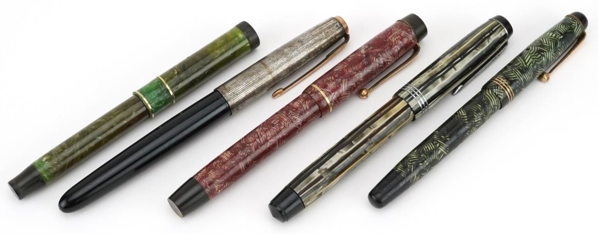 Five vintage Parker fountain pens, four marbleised, including Duofold, Lucky Curve and 51 with