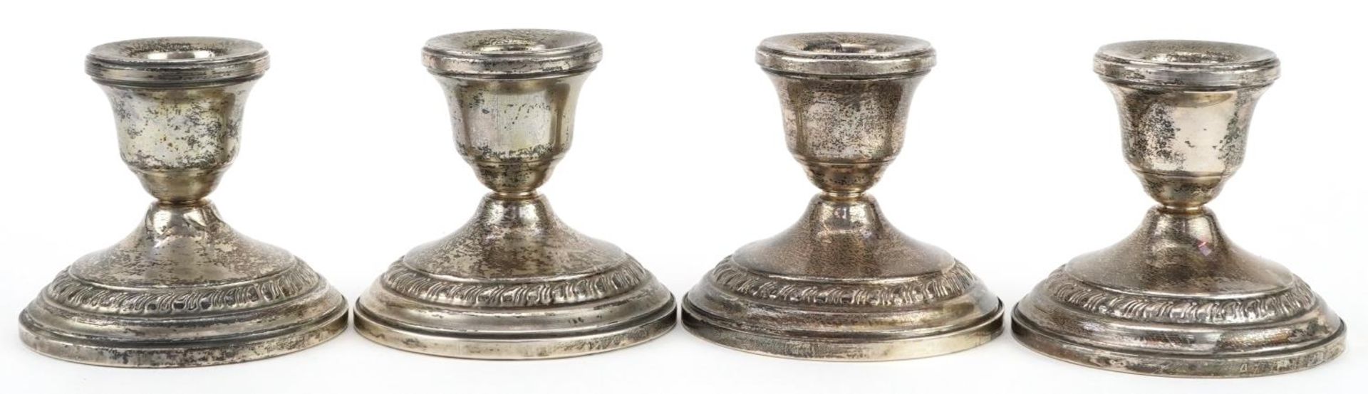 Columbia, set of four circular sterling silver weighted dwarf candlesticks, 8cm in diameter, total - Image 2 of 4