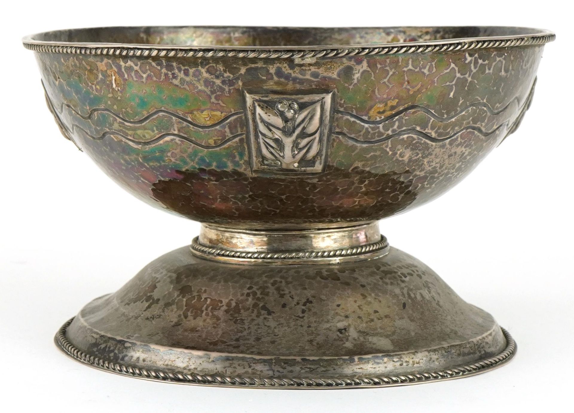 Arts & Crafts circular unmarked hammered silver pedestal bowl embossed with stylised flowers and
