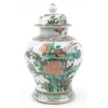 Chinese porcelain baluster vase and cover hand painted in the famille rose palette with birds of