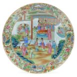 Chinese Canton porcelain celadon ground charger hand painted in the famille rose palette with an