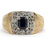 Heavy unmarked gold sapphire and diamond ring with engraved shoulders, tests as 9ct gold, the