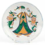 Turkish Ottoman Iznik pottery footed plate hand painted with a figure in traditional dress amongst