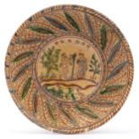 19th century earthenware plate with glazed Adam & Eve incised decoration, 34cm in diameter : For