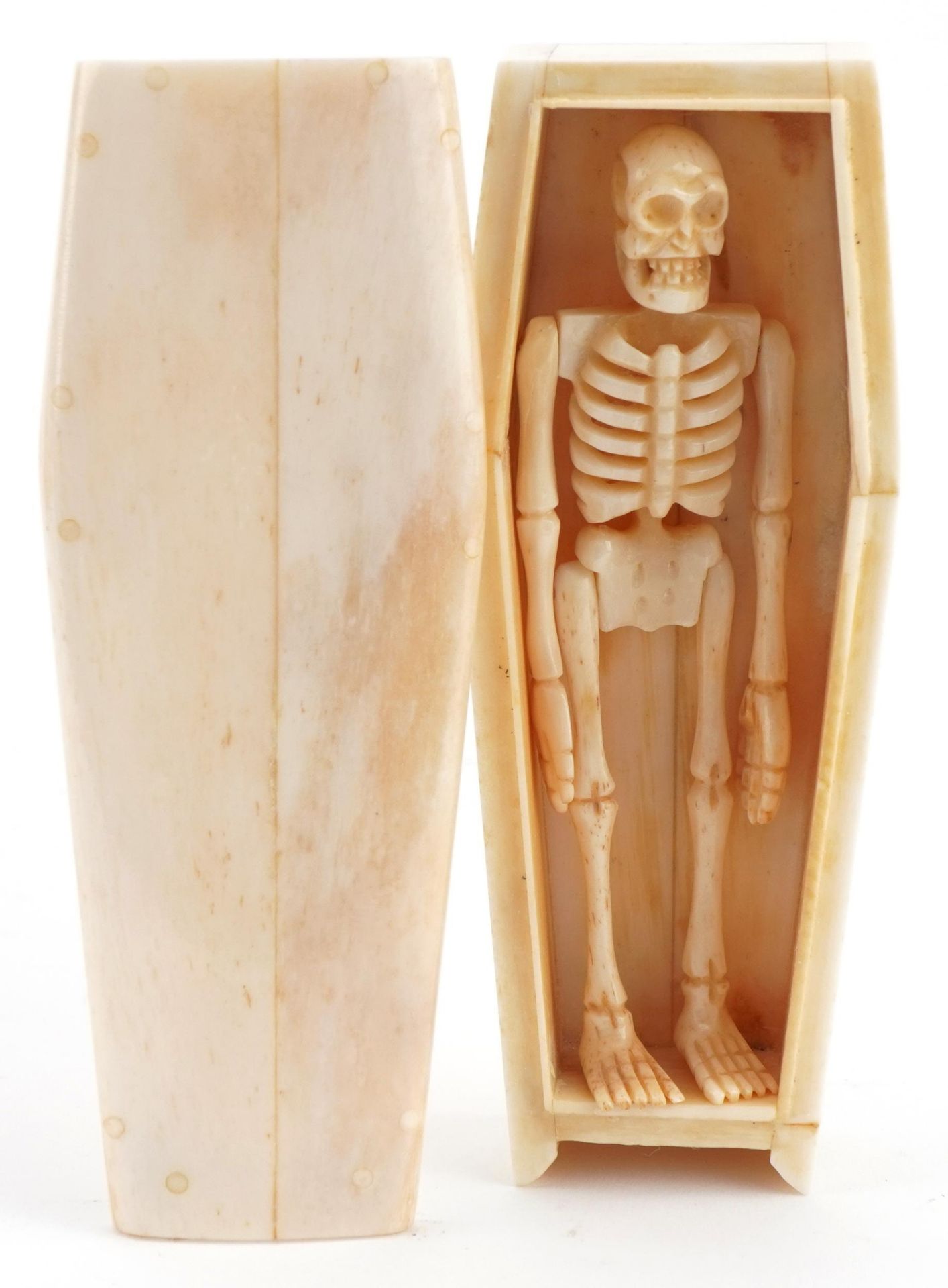 Novelty carved bone articulated skeleton housed in a sectional bone coffin, the largest 11.5cm in - Image 2 of 6
