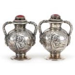 Pair of Edwardian silver and enamel casters with mask design twin handles and embossed with