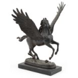 Classical patinated bronze sculpture of Pegasus raised on a rectangular black marble base, 30.5cm