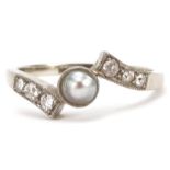 18ct white gold pearl and diamond crossover ring, the largest diamond approximately 1.80mm in