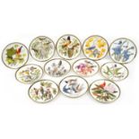 Set of twelve Franklin porcelain Songbirds of the World collector's plates with certificates, 27.5cm