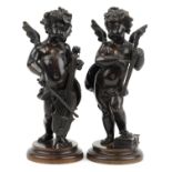 Pair of 19th century Grand Tour classical patinated bronze figures of Putti playing instruments, the